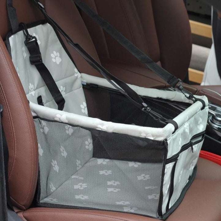 Foldable pet car hammock seat with padded support, adjustable tethers, and mesh sides for secure travel in car seat.