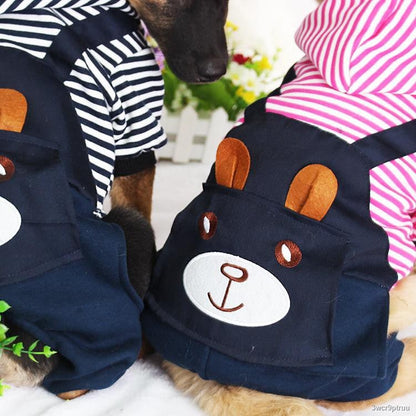 Two dogs wearing striped dog hoodies with bear face design on the back, cozy winter outfit for pets